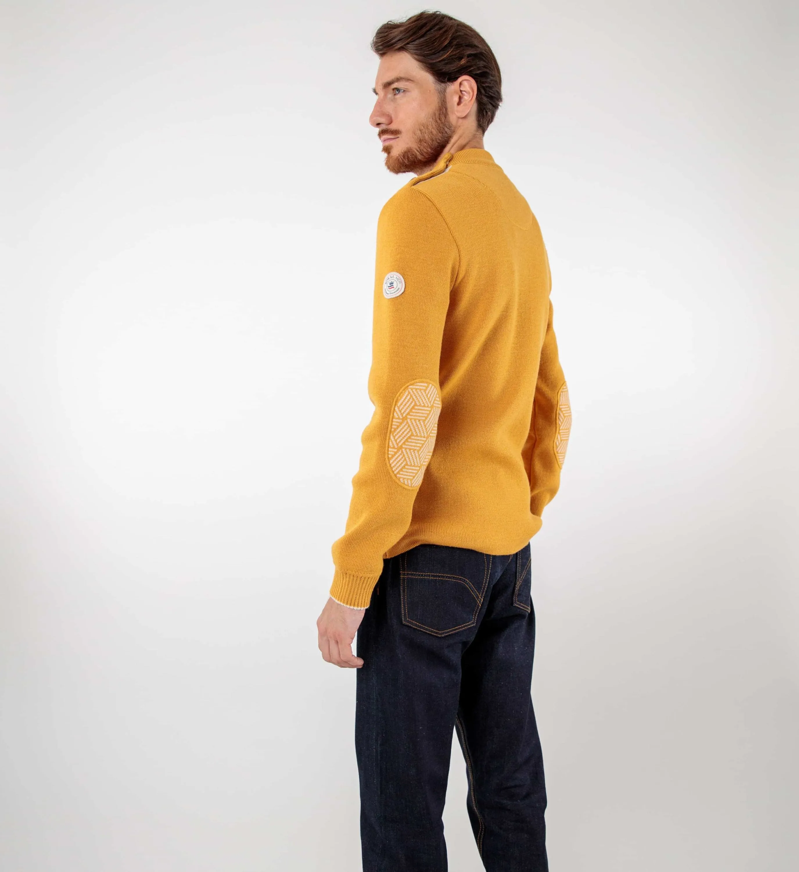 Pull marin uni coudières fantaisies
